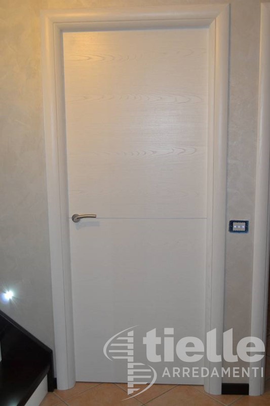 Porta a battente con anta in listellare Porte