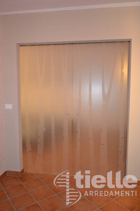 Porta scorrevole a due ante Porte